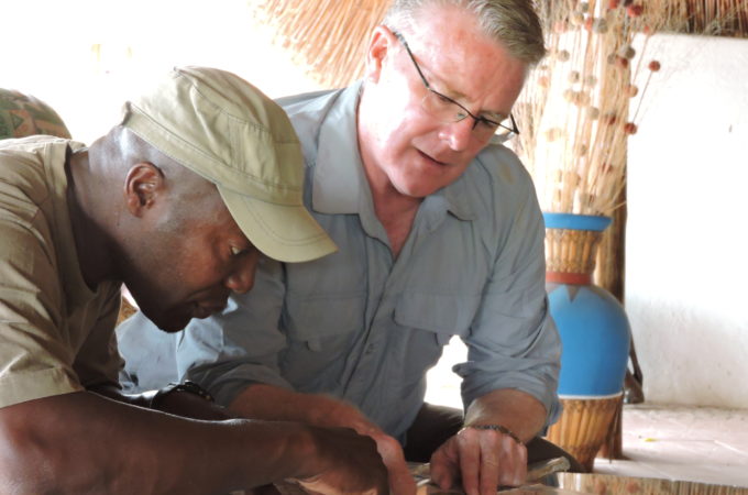 Image of Steve Dunn and another man studying a map